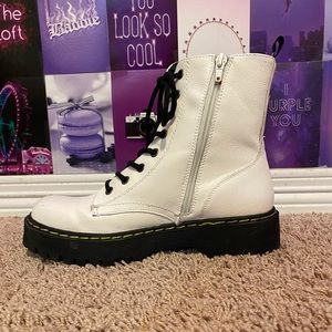 White boots with black laces (not Doc Martin’s)